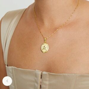 The M Jewelers Oval Angel Necklace